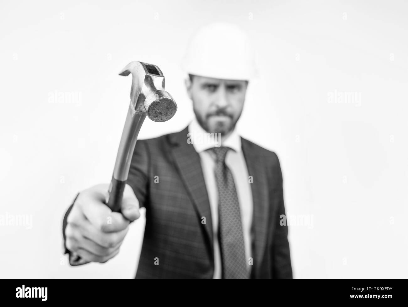 construction hammer tool and businessman isolated on white. safety