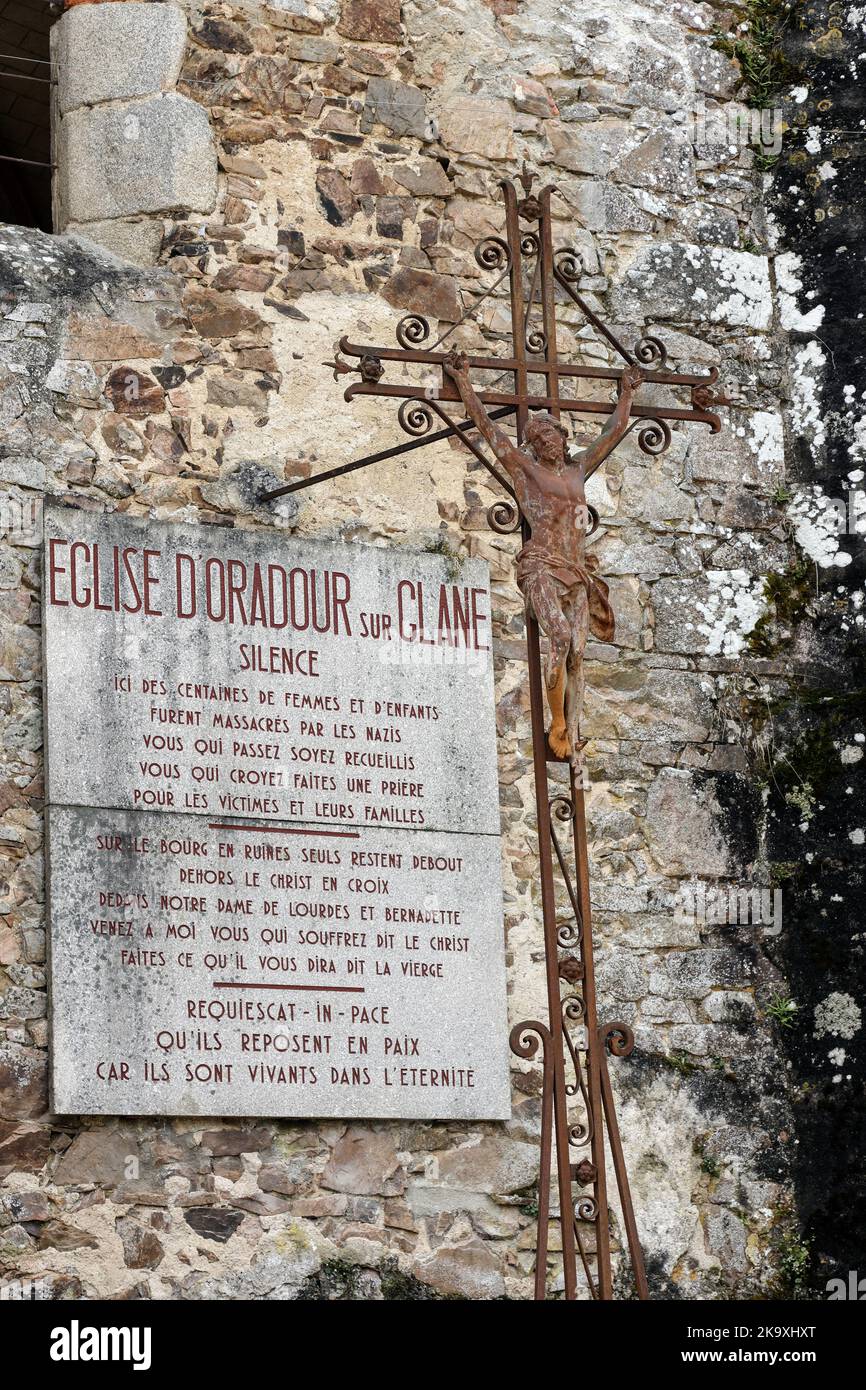 Memorial Plaque on the Church of Oradour-sur-Glane where the women and children were Murdered by the Nazis on 10th June 1944 in the Haute-Vienne, Fran Stock Photo