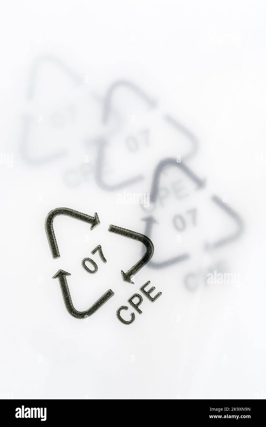 Close-up shot of 07 plastic resin code / Resin Identification Code 7 on plastic packaging. Here CPE refers to the recycling of composite plastics. Stock Photo