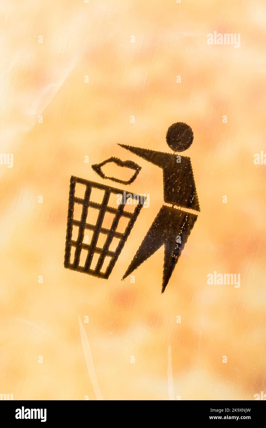 Recycling symbols - Tidyman pictogram - on plastic bag covering of a product box. International recycling symbols, recycling symbol, keep Britain tidy. Stock Photo