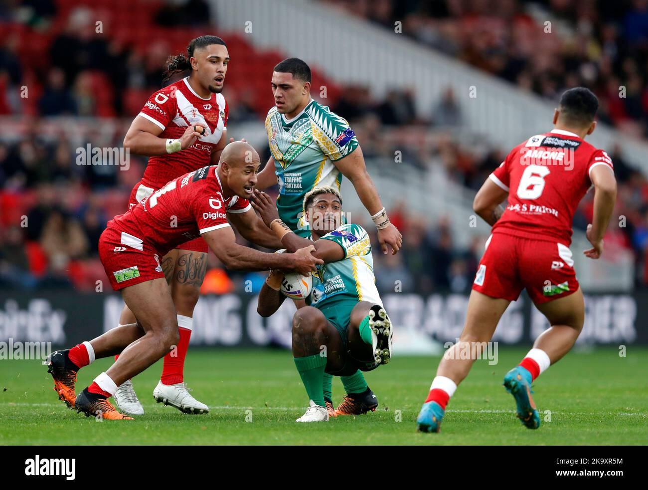 Cook Islands' Steven Marsters tackled by Tonga's Felise Kaufusi during the Rugby League World Cup group D match at the Riverside Stadium, Middlesbrough. Picture date: Sunday October 30, 2022. Stock Photo