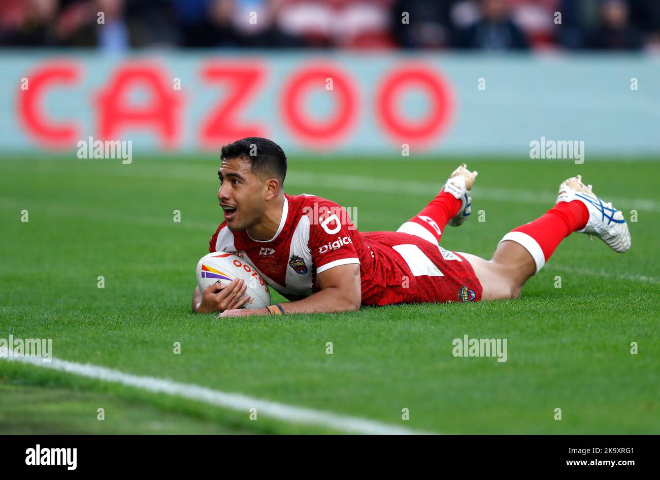 Tonga's Will Penisini scores a try during the Rugby League World Cup