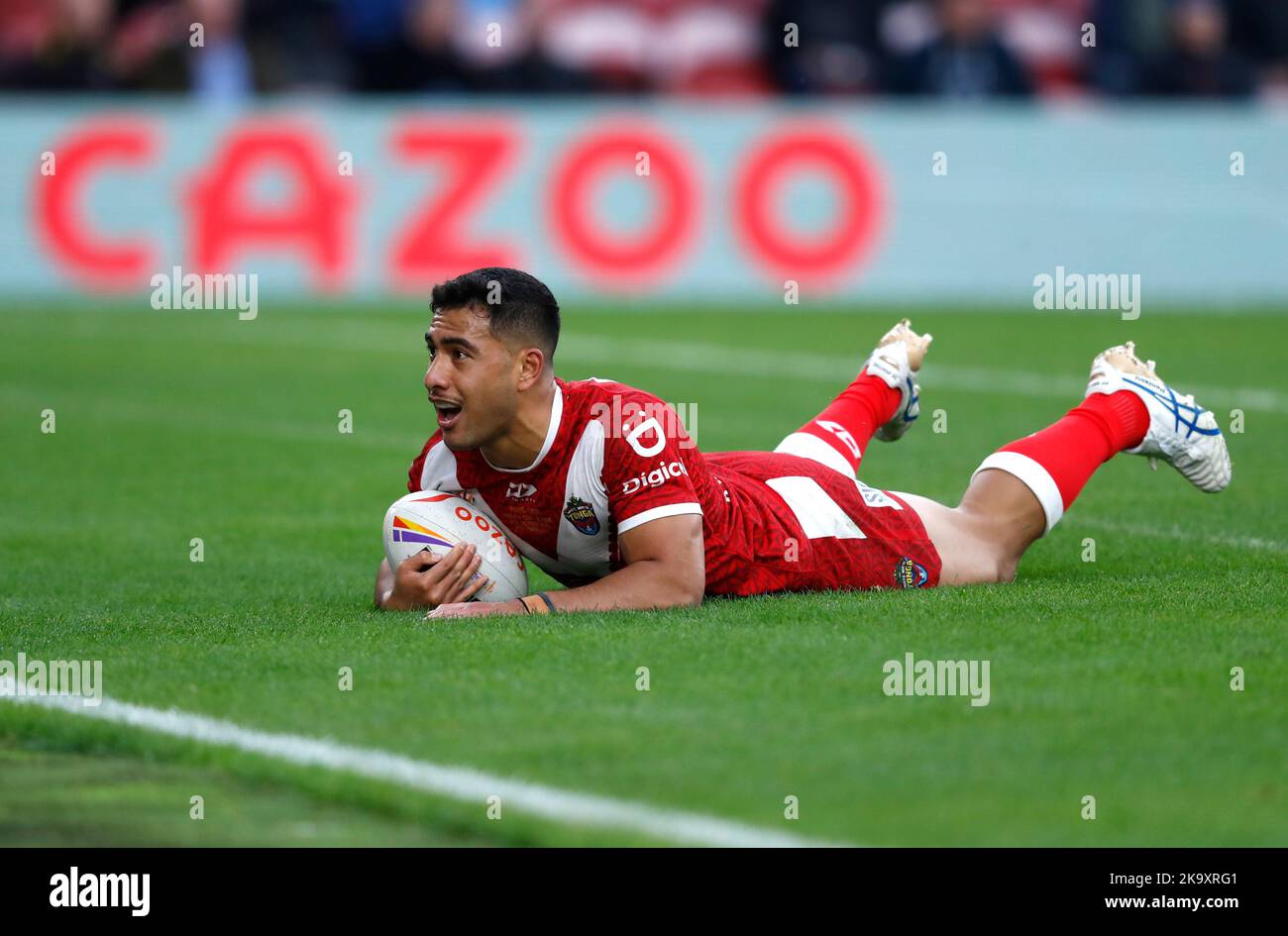 Tonga's Will Penisini scores a try during the Rugby League World