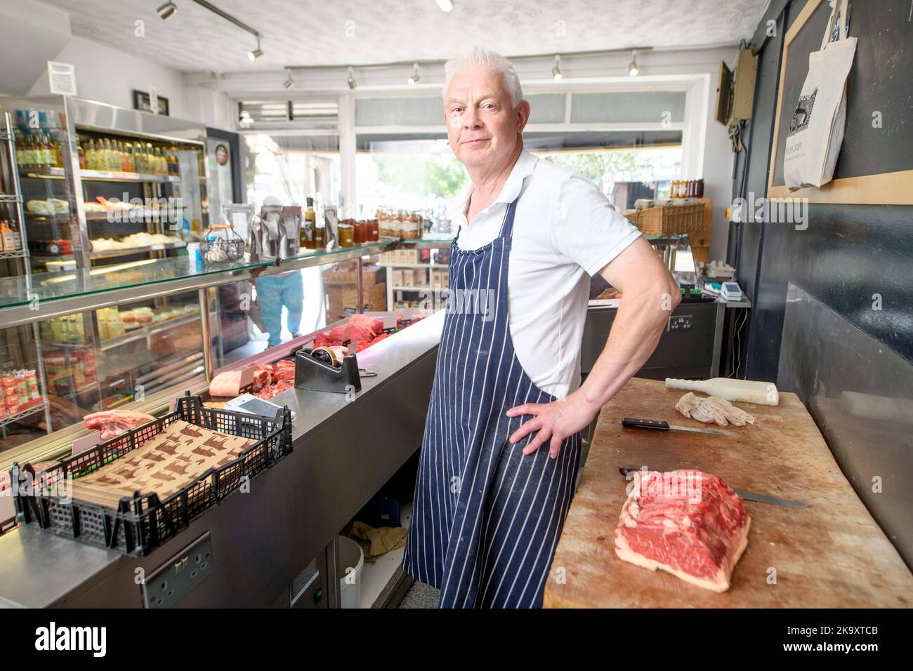 A butcher in the town of Glastonbury in Somerset. Stock Photo