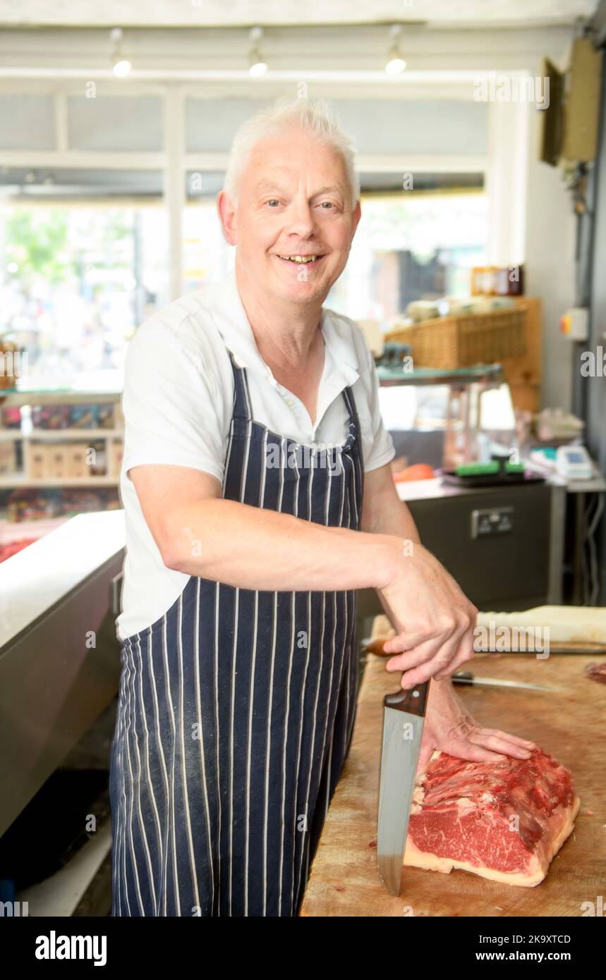 A butcher in the town of Glastonbury in Somerset. Stock Photo