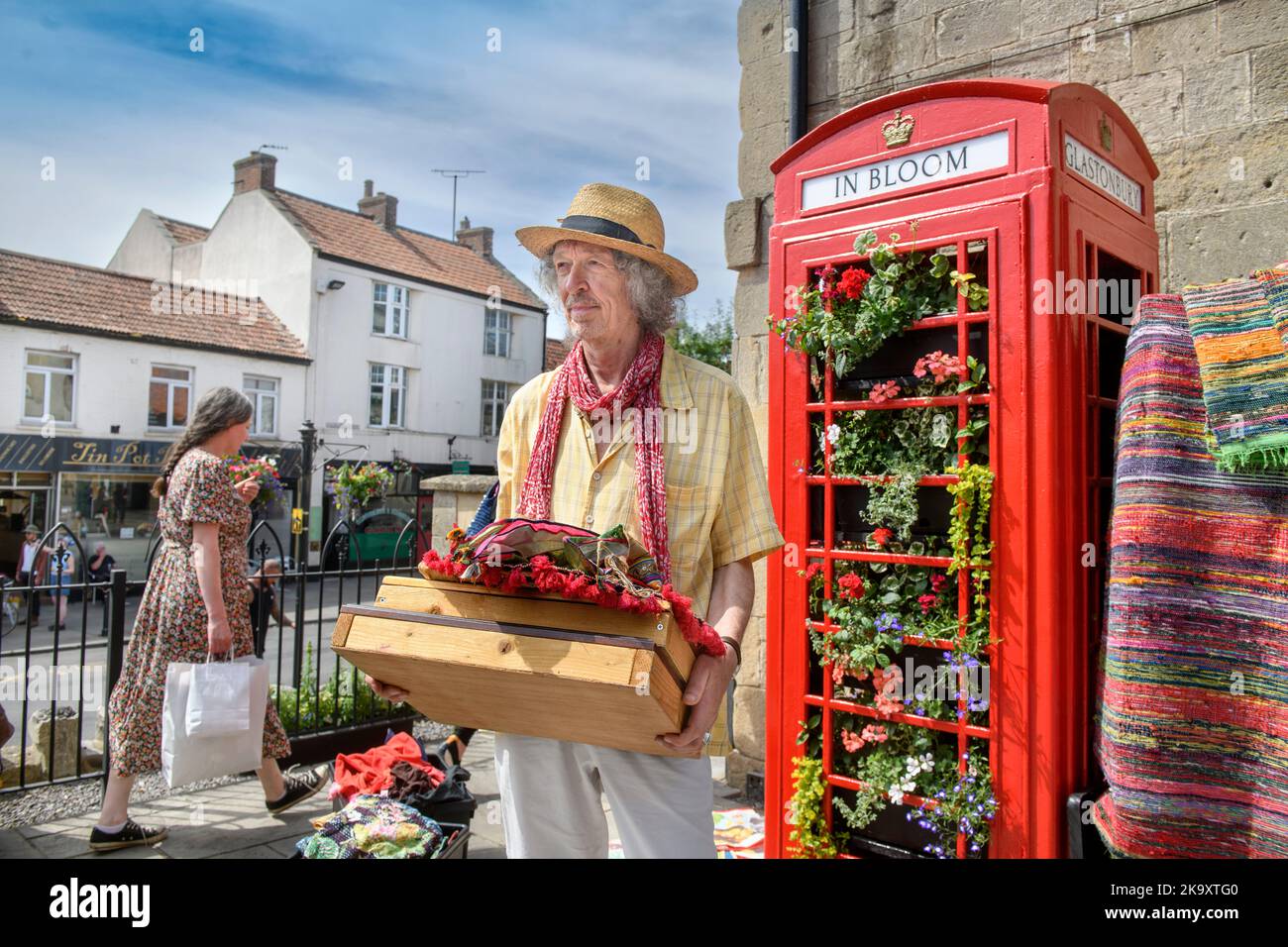 Jewellery and Indian textiles stallholder Dan Crane with a telephone