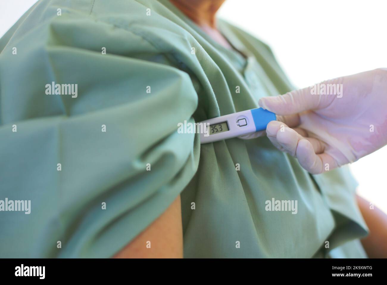 Body temperature check with digital thermometer Stock Photo - Alamy