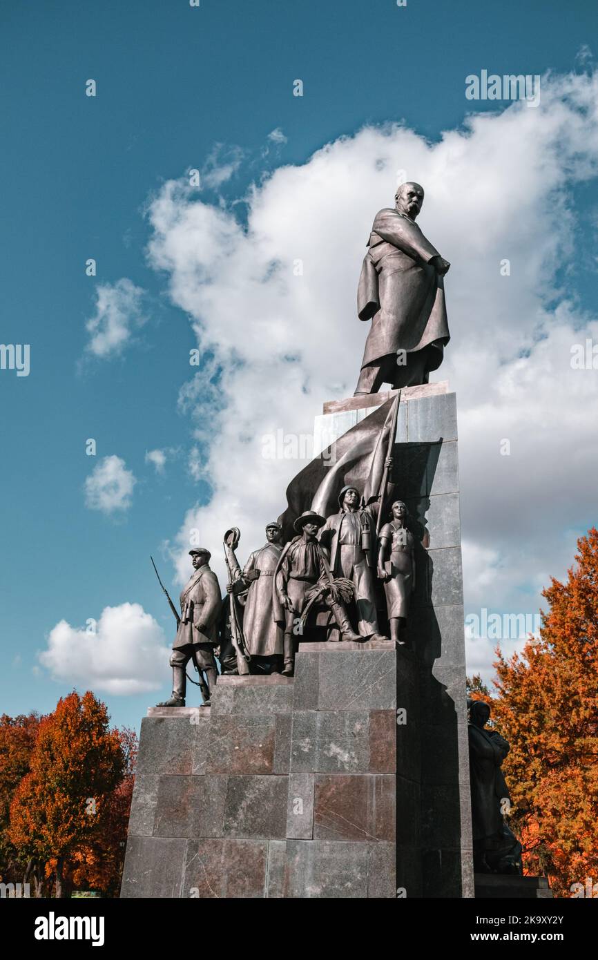 Taras Shevchenko Monument in Ukraine, Kharkiv city center park. Kobzar statue in autumn colorful trees in Shevchenko City Garden Stock Photo