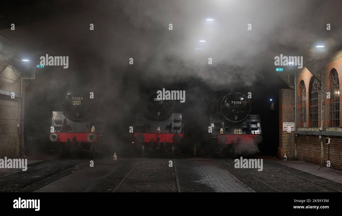 Steam locomotives in th shed at the end of a busy day on the Bluebell Railway Stock Photo