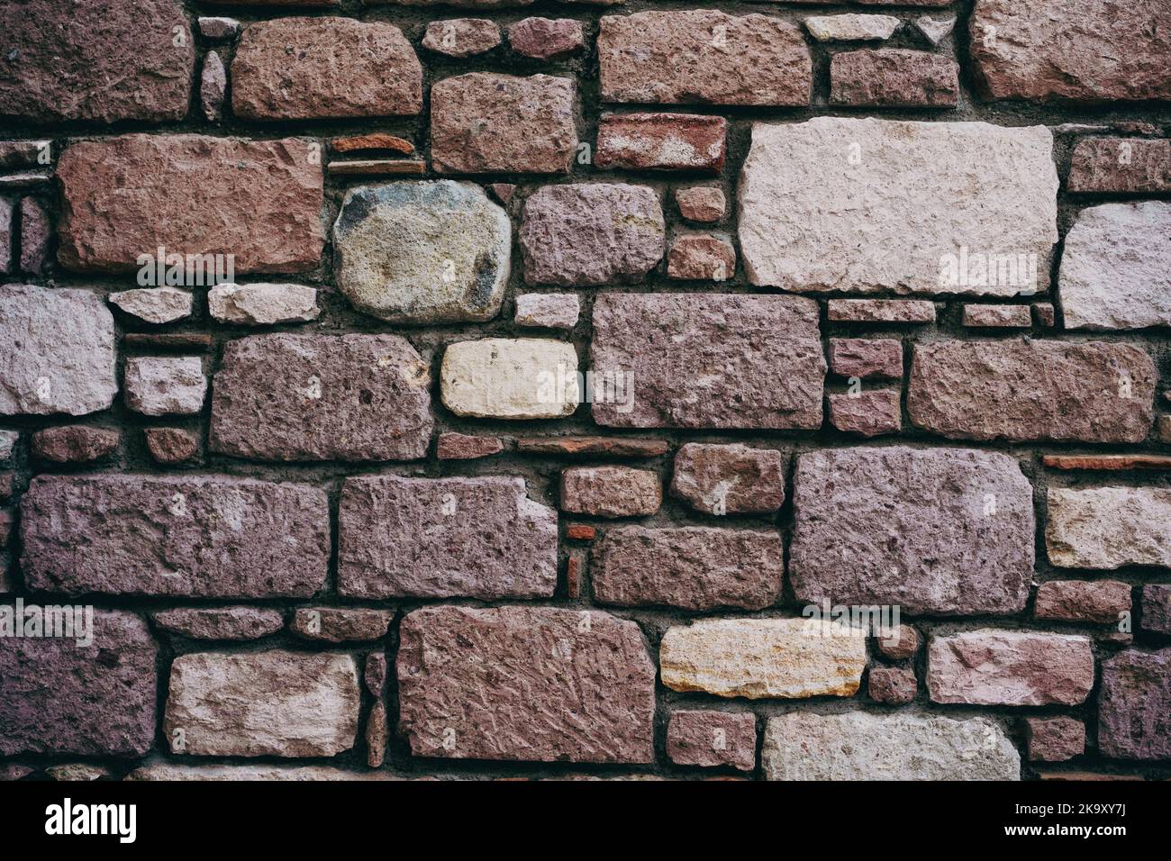 Vertical shot of stone tiles wall, background, texture, pattern. Stock Photo