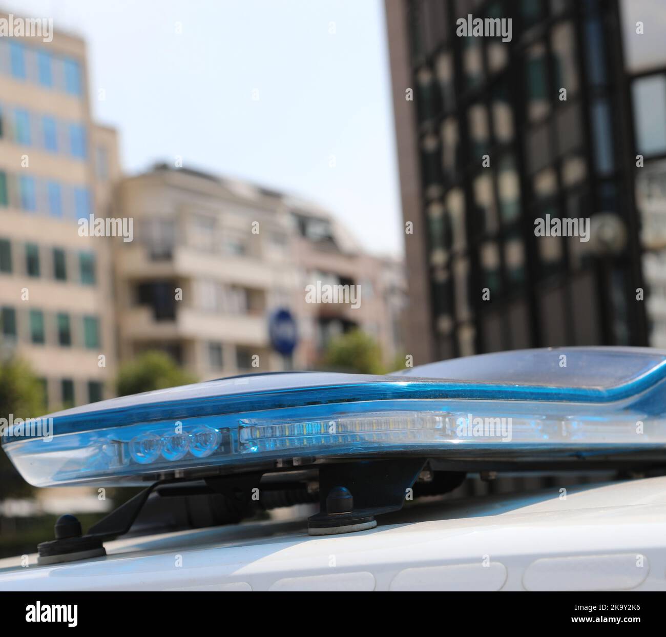 blue flashing lights of the police car while patrolling in the city