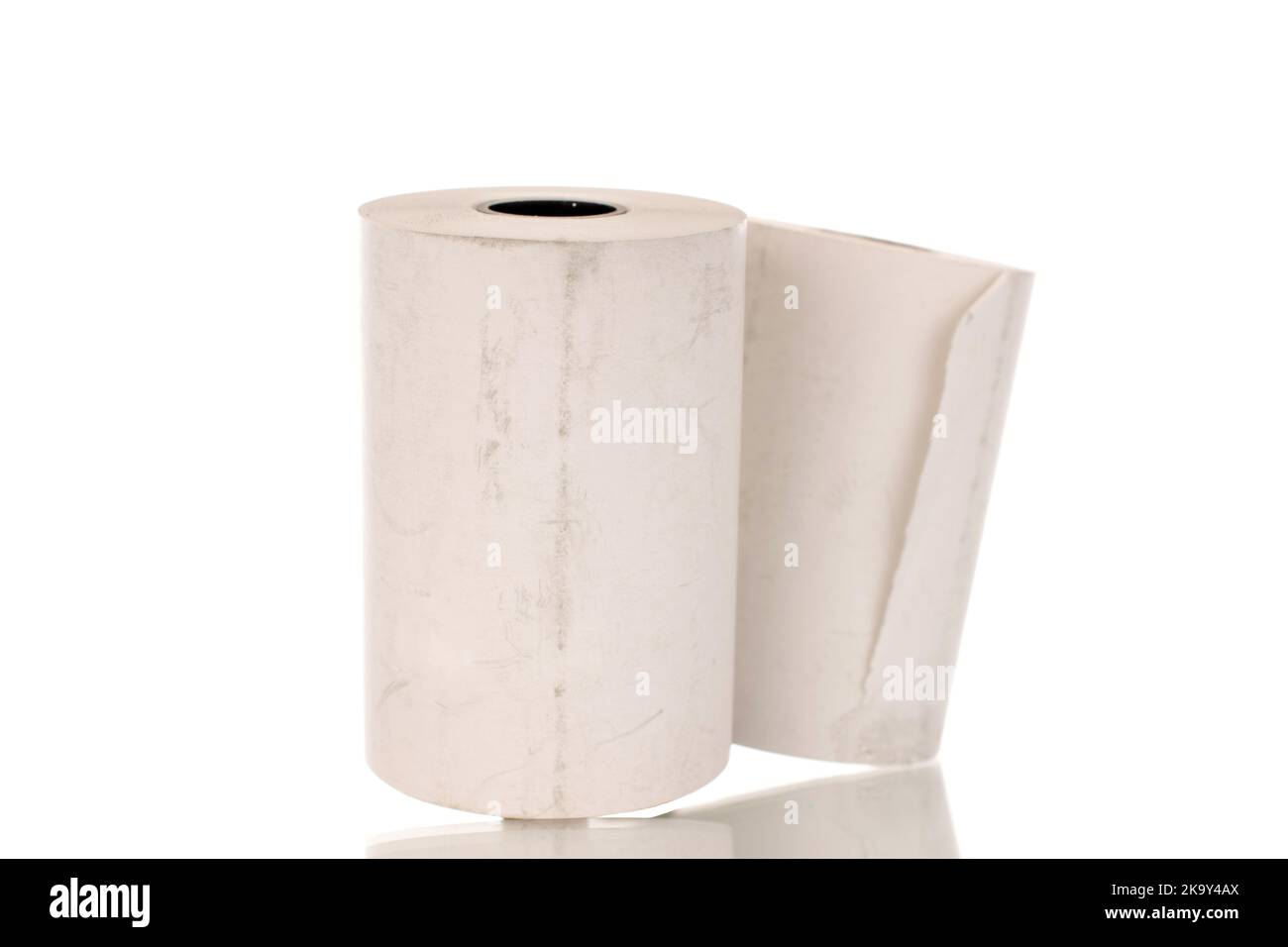Two rolls of paper cash register tape, closeup isolated on white Stock