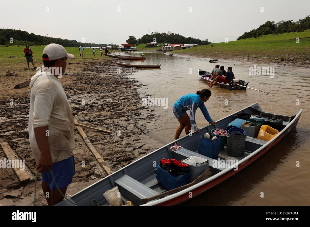 People arrive on the shores of the shallow Negro river to cast their votes at a polling station, in the Catalao community, in Iranduba, Amazonas state, Brazil October 30, 2022. REUTERS/Bruno Kelly Stock Photo