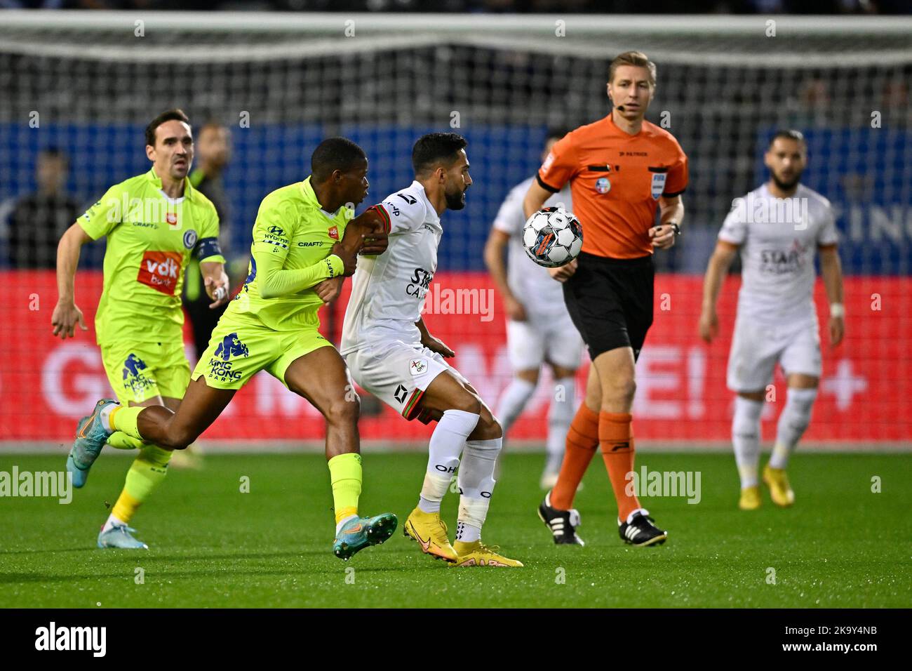 Gent's Mathias Nurio Fortuna and OHL's Mousa Suleiman Tamari fight for