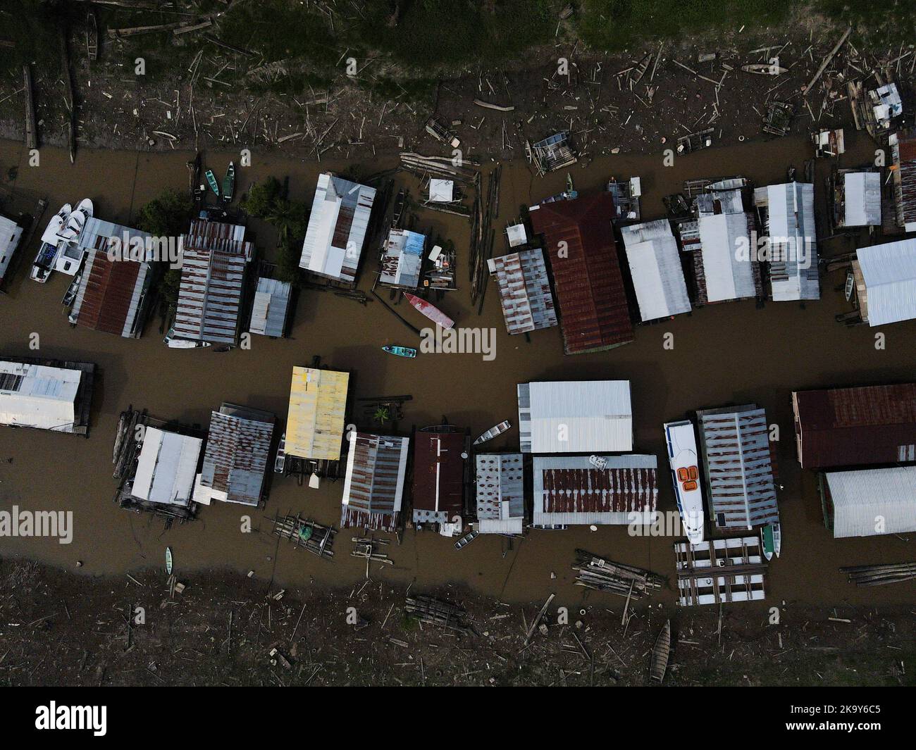 Floating houses stand in the shallow waters of the Negro river which has it made difficult for voters to reach the polling station as their only transportation is by boat, in the Catalao community, in Iranduba, Amazonas state, Brazil October 30, 2022. REUTERS/Bruno Kelly Stock Photo
