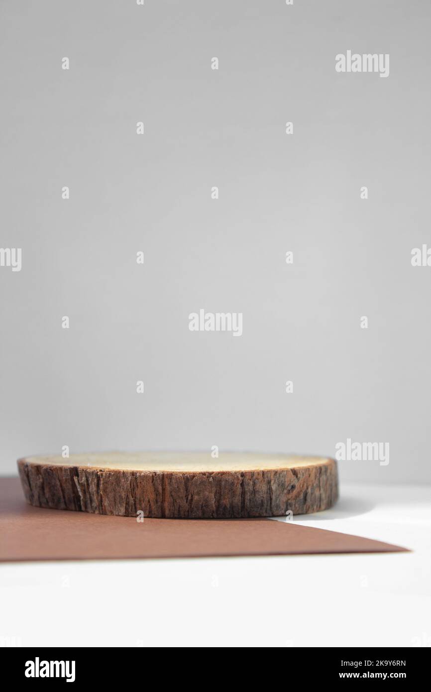 empty piece of wood podium minimalism on grey background. Copy space, place for text.vertical photo Stock Photo