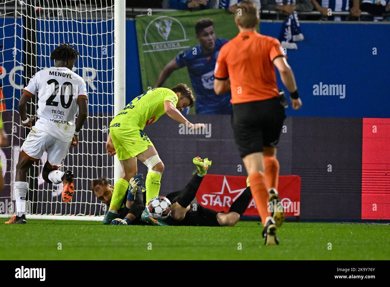 OHL's goalkeeper Valentin Cojocaru and Gent's Matisse Samoise fight for