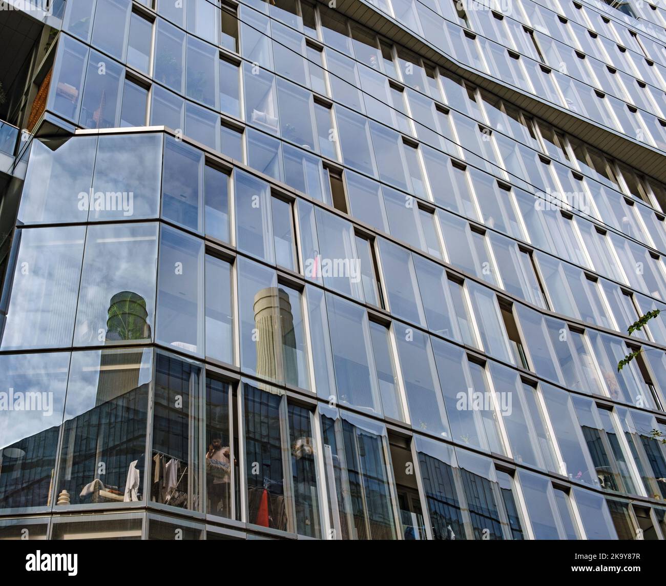 Reflections of two iconic chimneys of Battersea Power Station on the ...