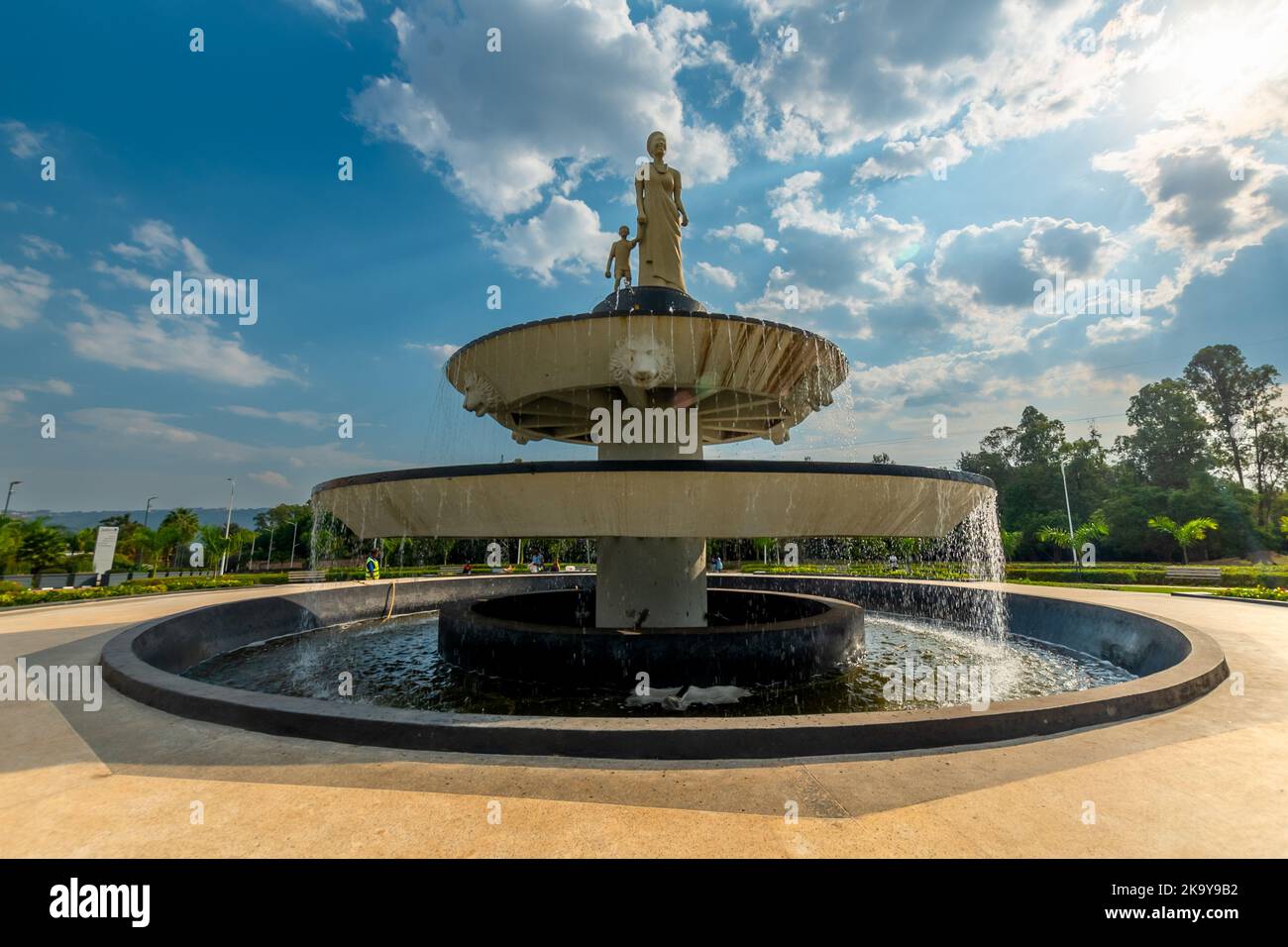 Kigali, Rwanda - August 19 2022: A fountain with a statue of a woman and child in traditional Rwandan clothing. Stock Photo