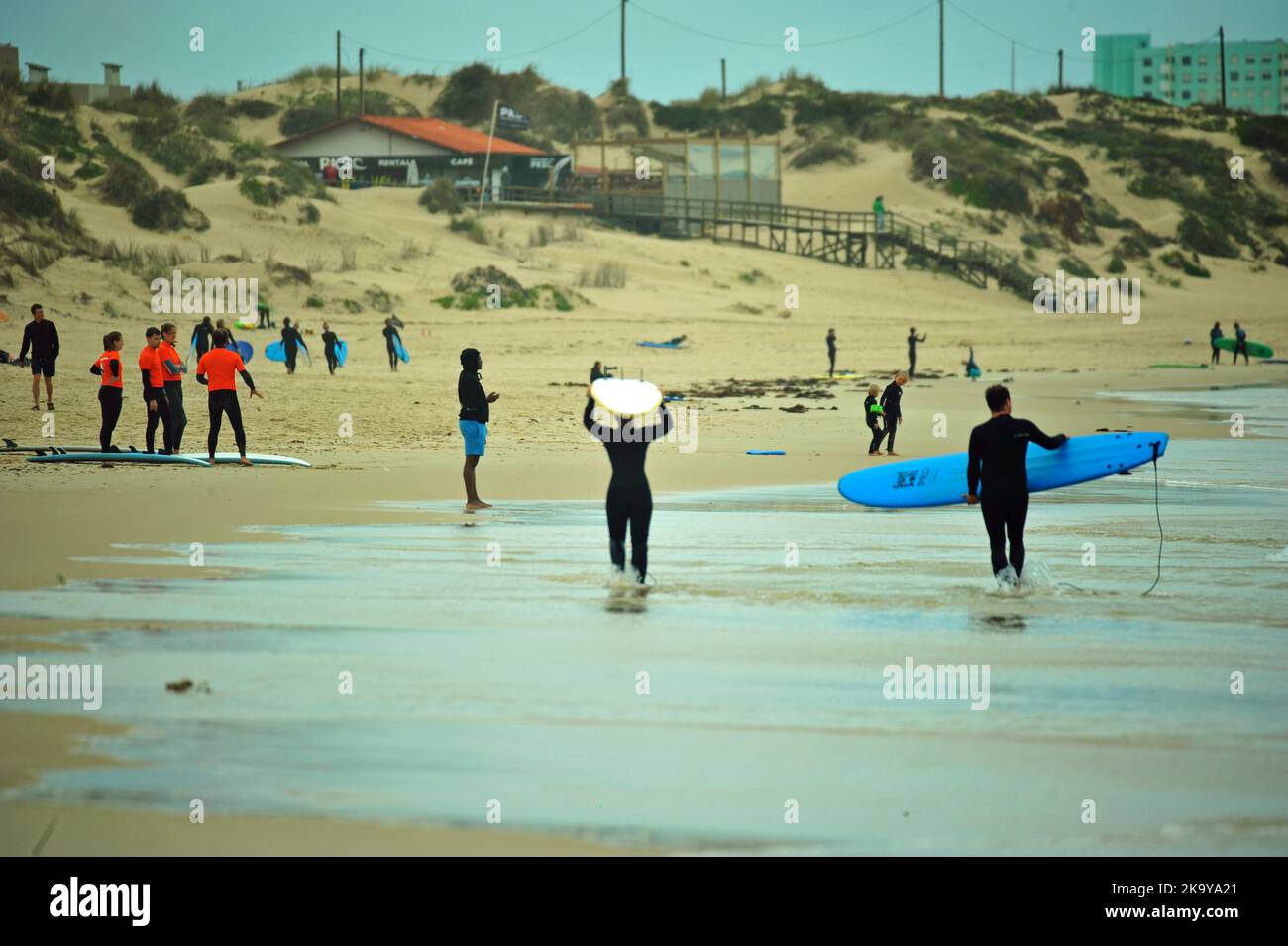 Surfers on the beach, Peniche, Portugal Stock Photo