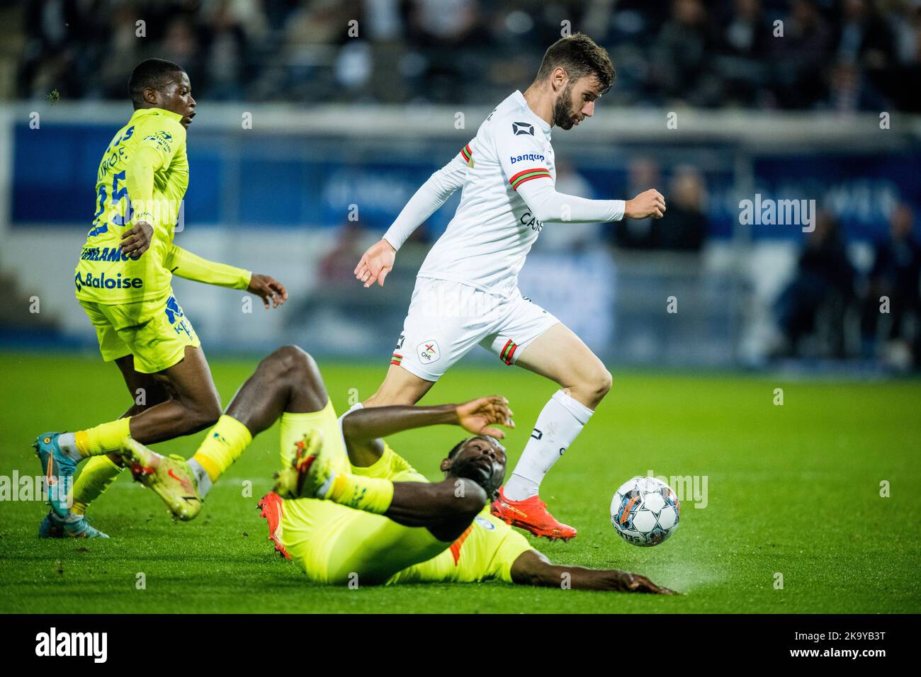 Gent's Michael Ngadeu and OHL's Mario Gonzalez fight for the ball