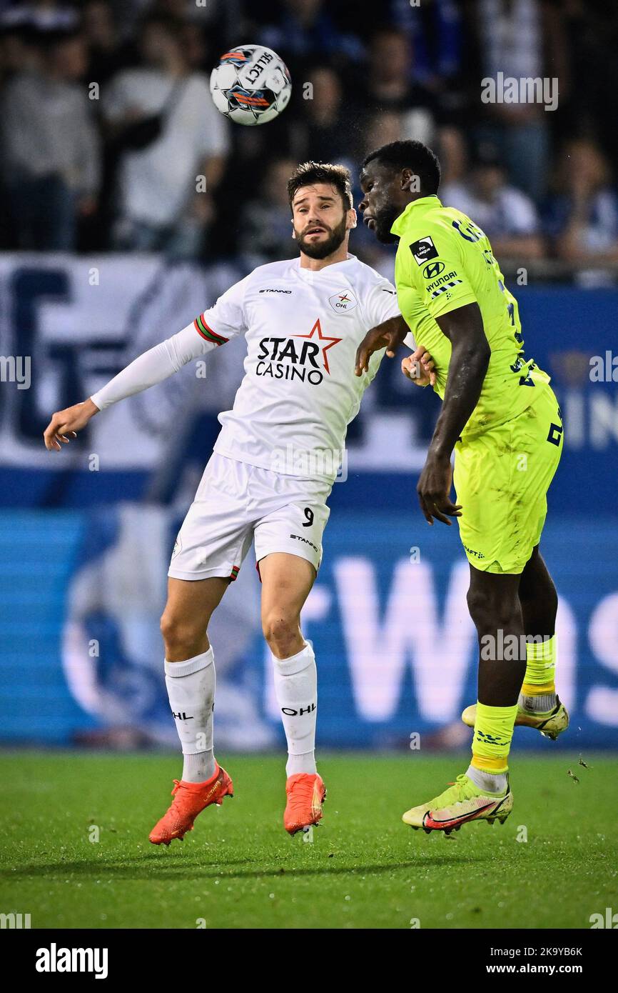 OHL's Mario Gonzalez and Gent's Michael Ngadeu fight for the ball