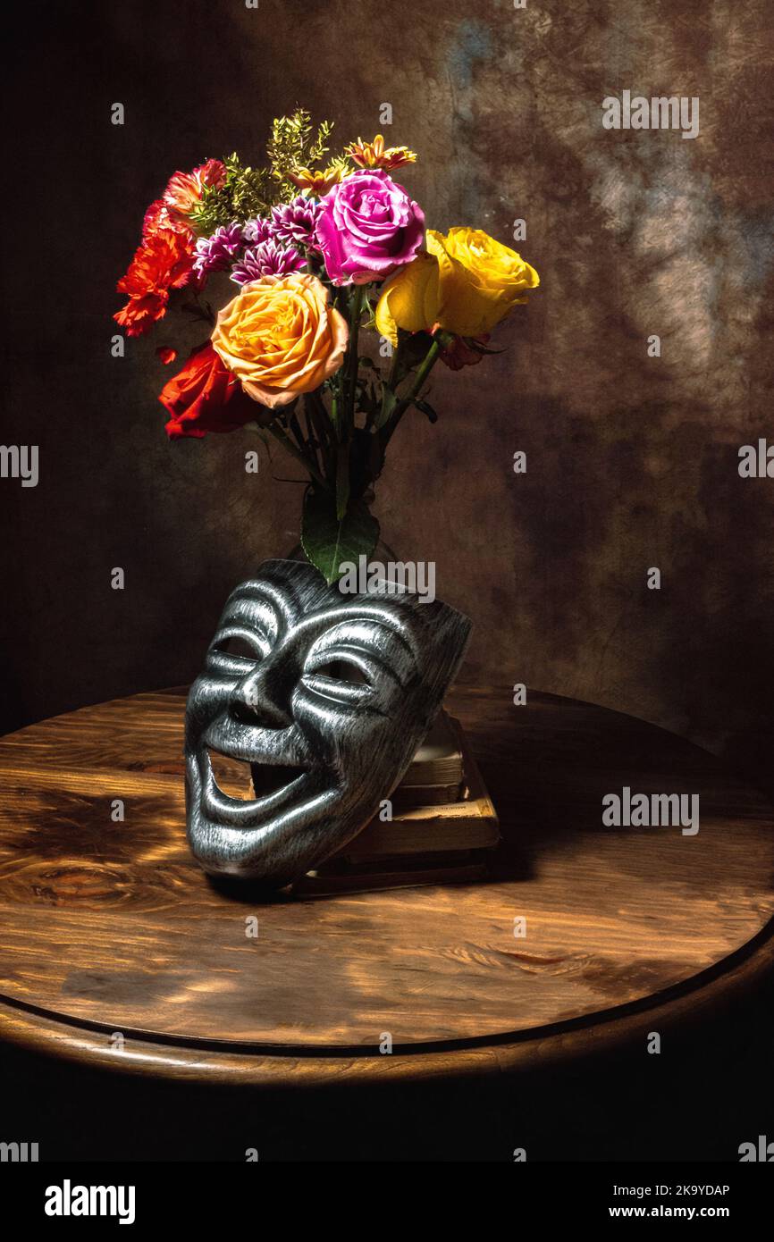 Still Life of masks and flowers Stock Photo