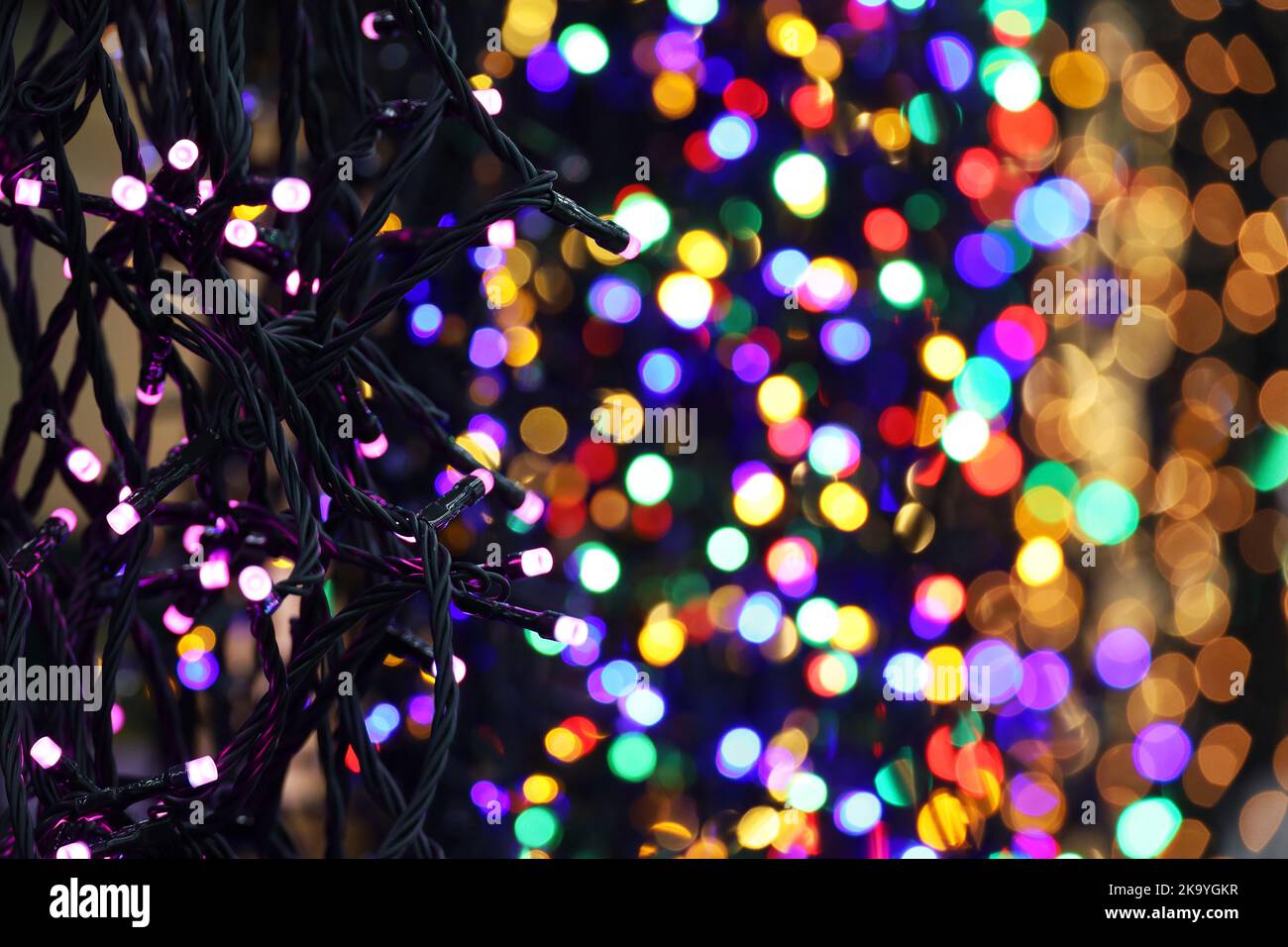 Christmas lights on electric garlands in a shop. New Year decorations