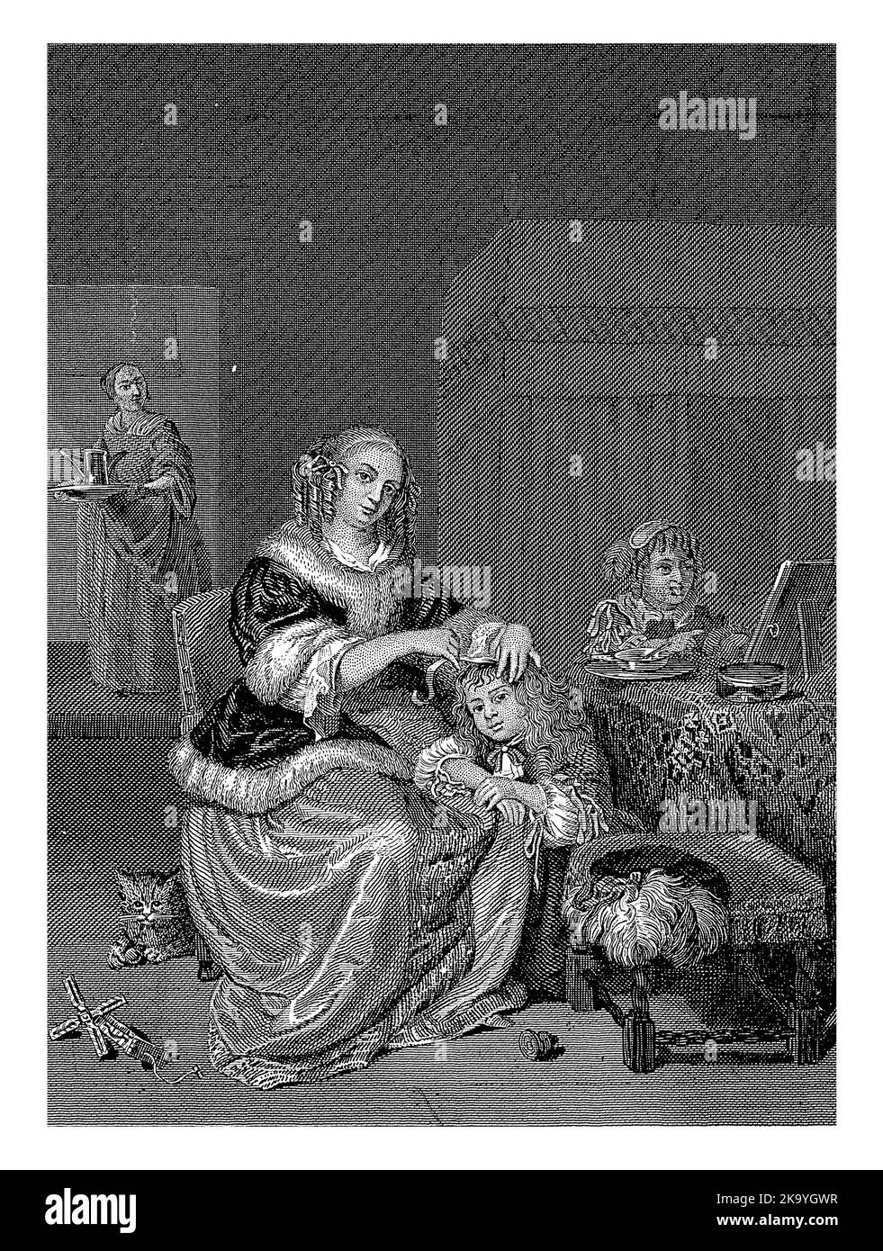 In a bedroom, a very richly dressed woman helps her son get dressed. A girl is sitting next to it at a table. She sticks out her tongue at her reflect Stock Photo