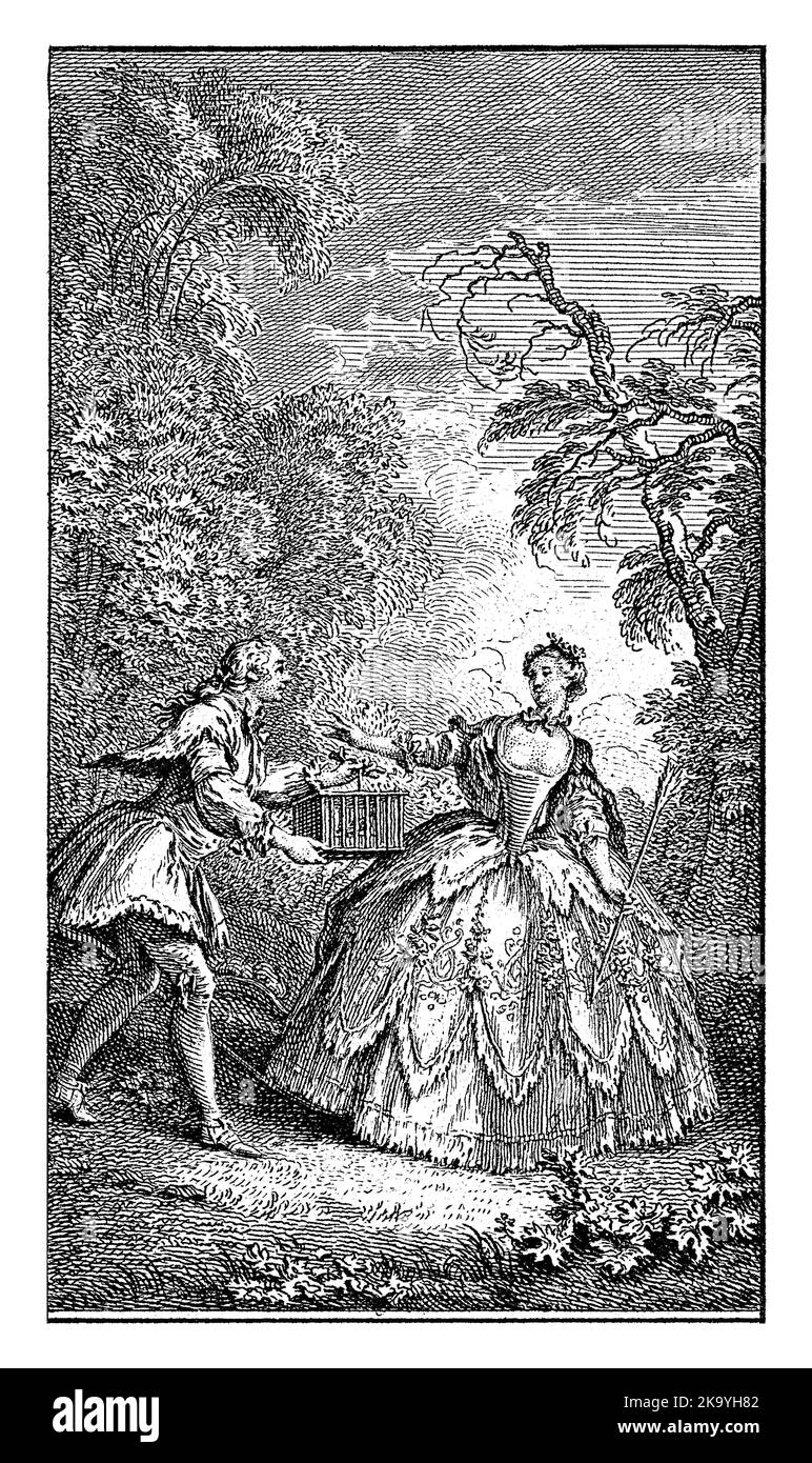 A man gives a birdcage to a woman in the forest. She is holding an arrow and pointing into the distance. Scene from the play Melicerte, by Moliere. Stock Photo