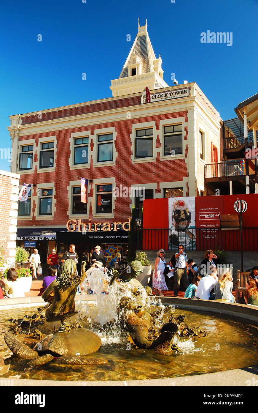Tourist gather around the water fountain with a sculpture called Andrea