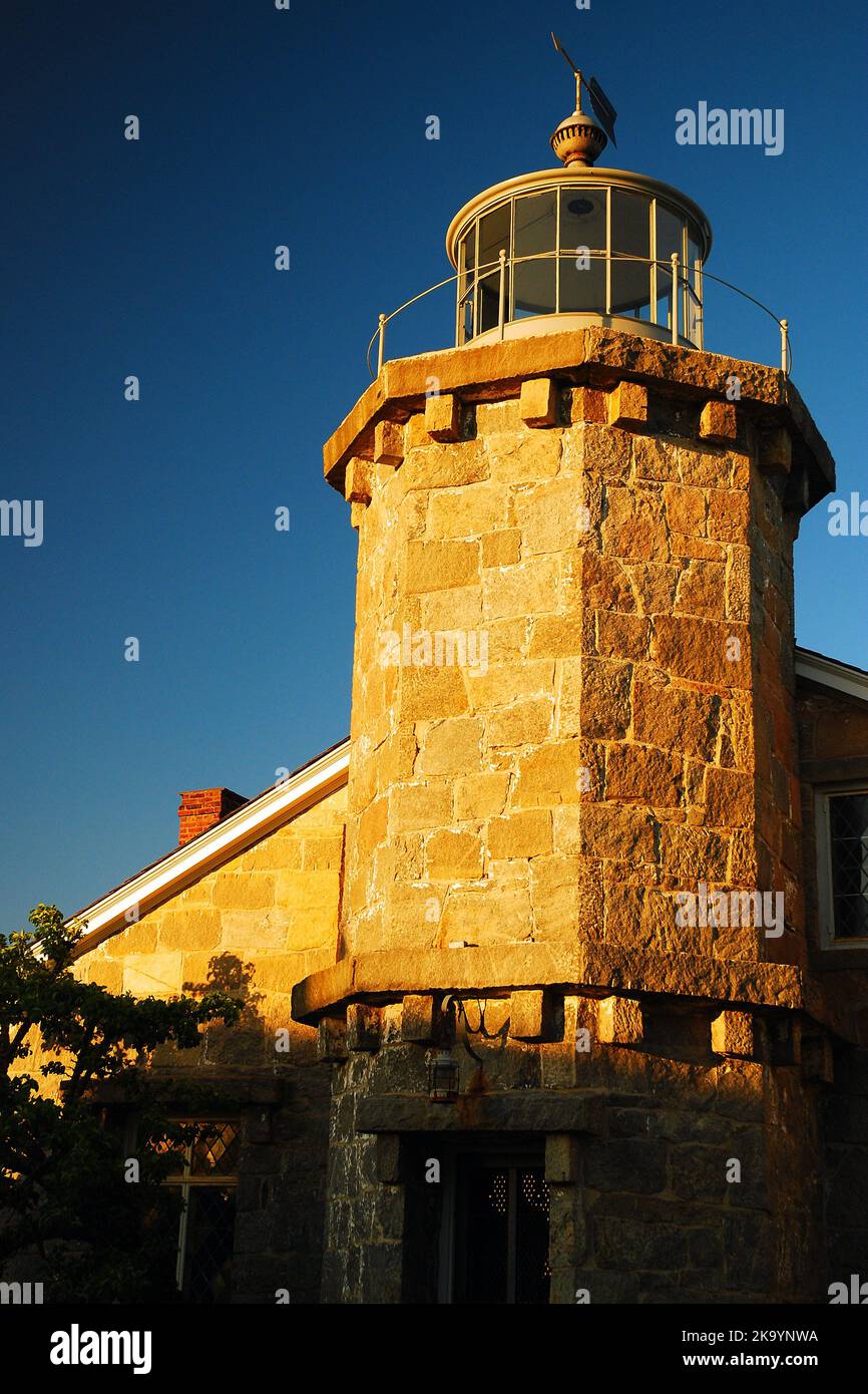 The small Stonington Lighthouse stands on the coast of Connecticut