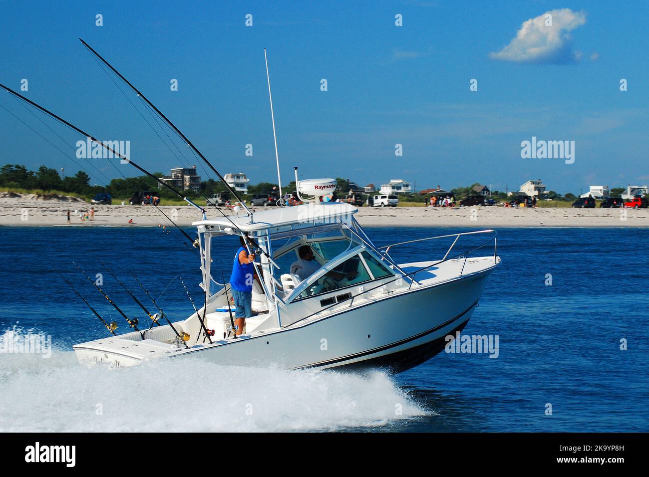 Boy driving boat hi-res stock photography and images - Alamy