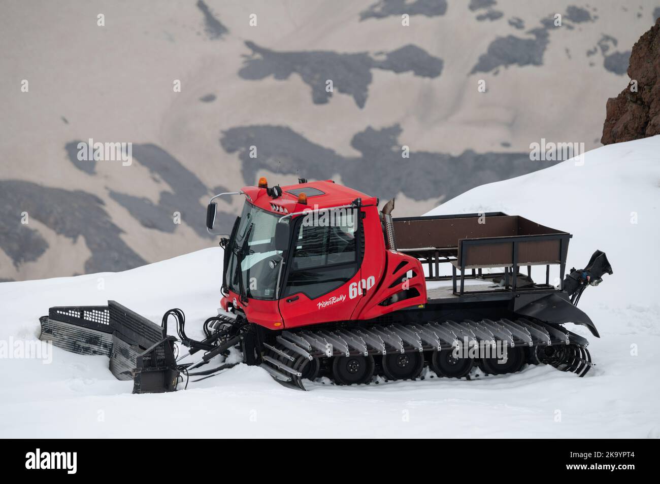 View of a ratrack preparing a slope for riding. Stock Photo
