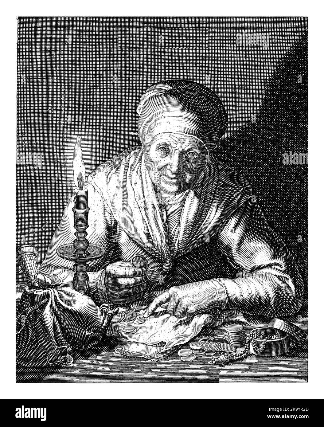 Old woman as personification of Avarice sits at the table by candlelight and counts her money and other riches. In the lower margin Latin verse in two Stock Photo