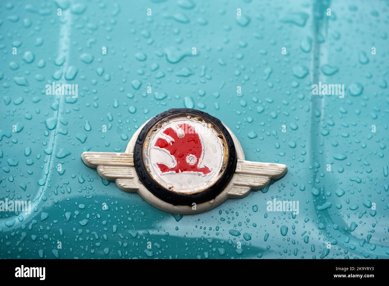 PRAGUE, CZECH REPUBLIC - OCTOBER 1, 2022: Old Skoda logo on a blue vintage car with droplets of water Stock Photo