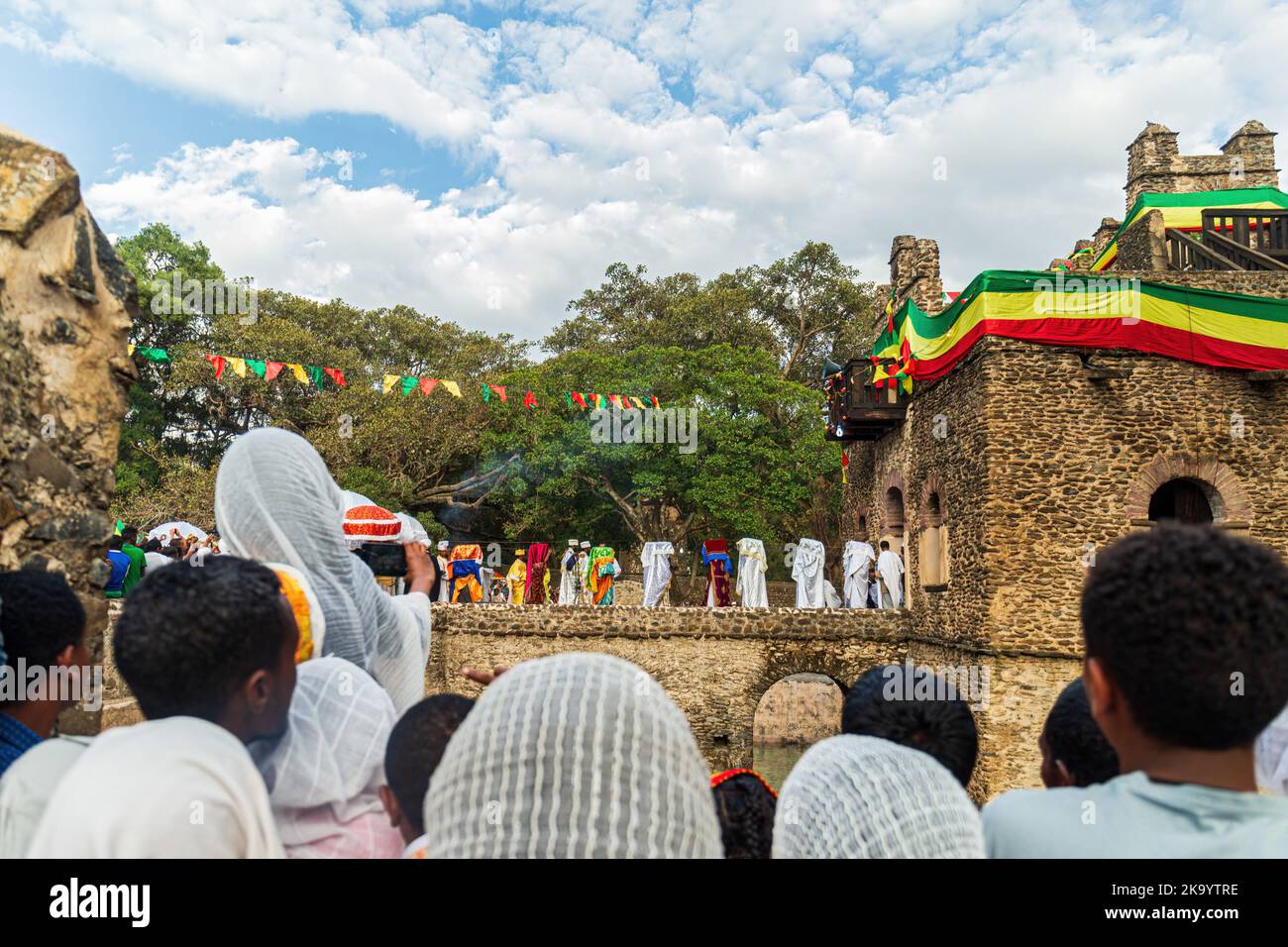 GONDAR, ETHIOPIA, JANUARY 18 2019: People at Fasilides Bath celebrating