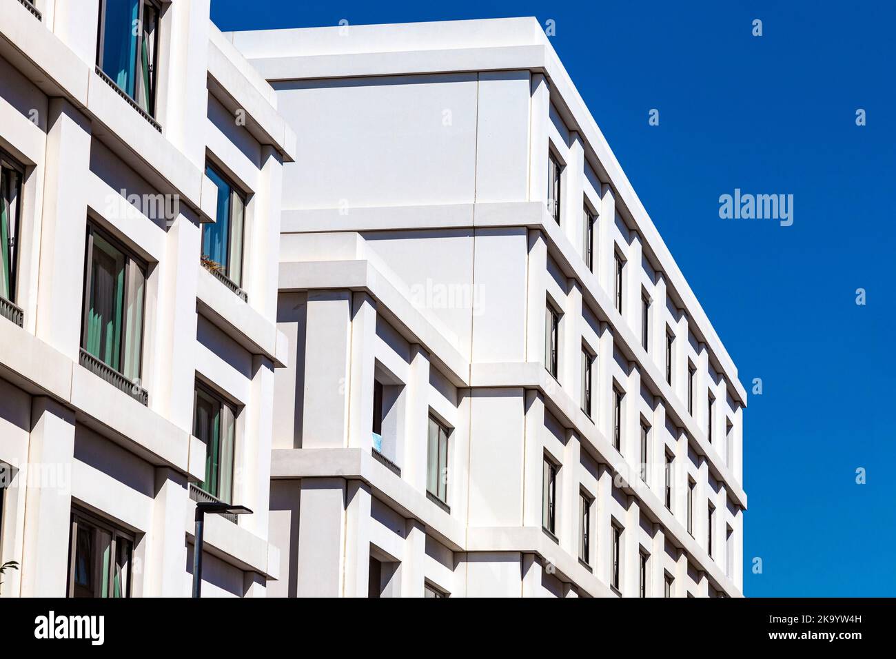 Close-up of white, residential new builds at Carpet Street, Sugar House Island, London, UK Stock Photo