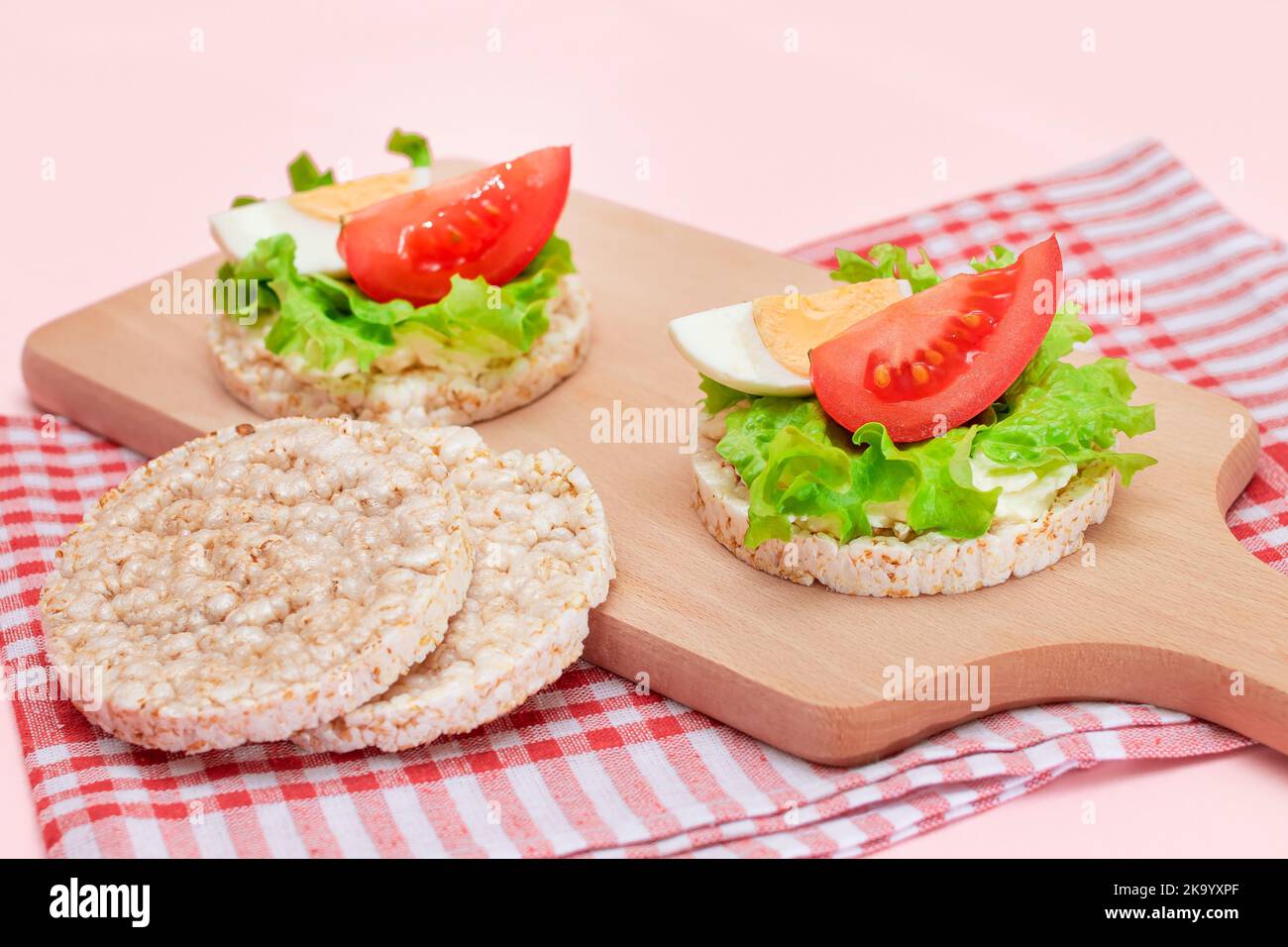 Rice Cake Sandwiches with Tomato, Lettuce and Egg on Wooden Cutting ...