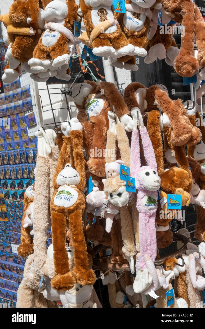Gibraltar. 2nd September 2022.  Cuddly toy monkeys hanging on a display rack outside a gift shop in Main Street, Gibraltar. Stock Photo