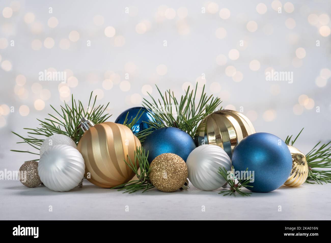 Christmas card with fir and decor on glitter background Stock Photo - Alamy