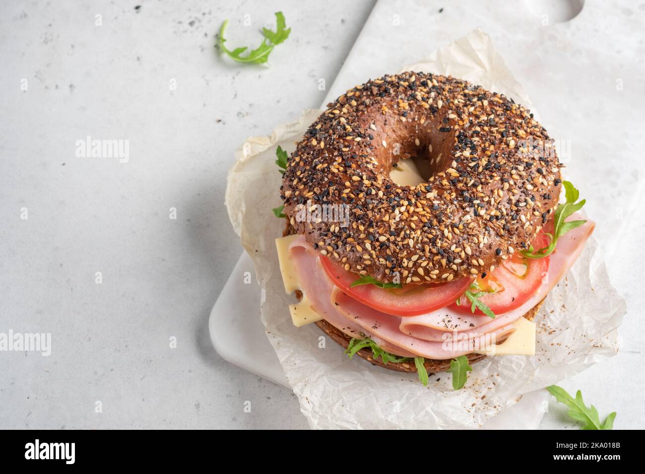 bagel filled with ham, cream cheese and tomato Stock Photo Alamy