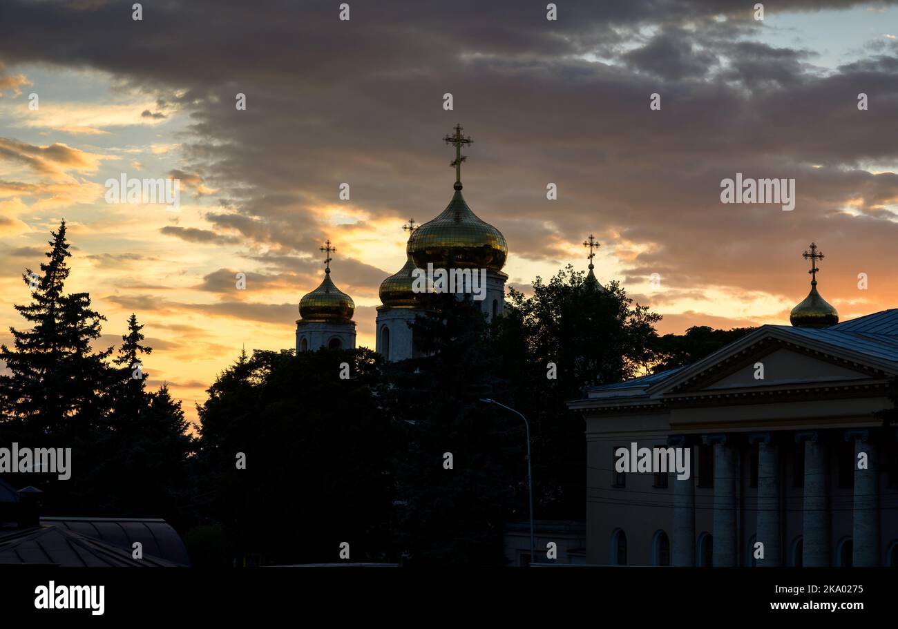 Pyatigorsk at sunset, Stavropol Krai, Russia. View of domes of Spassky Cathedral on dramatic sky background. Silhouette of Russian Orthodox church in Stock Photo