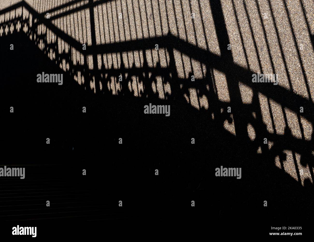Shadows of staircase with ornate balustrades and railings. Stock Photo