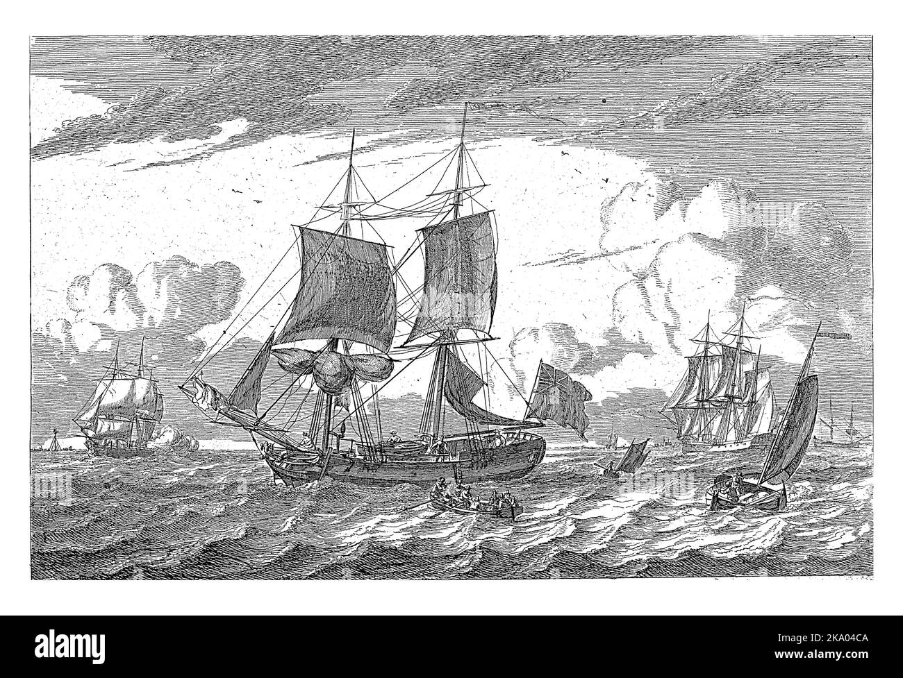 Several sailing ships on choppy water. In the foreground a two-master with an English flag. There is a sloop on the deck of the boat. Stock Photo