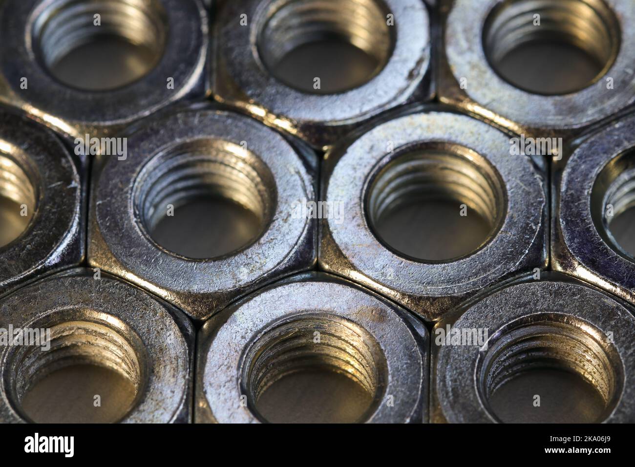 Organized Threaded Metal Hex Nuts On Flat Surface Stock Photo