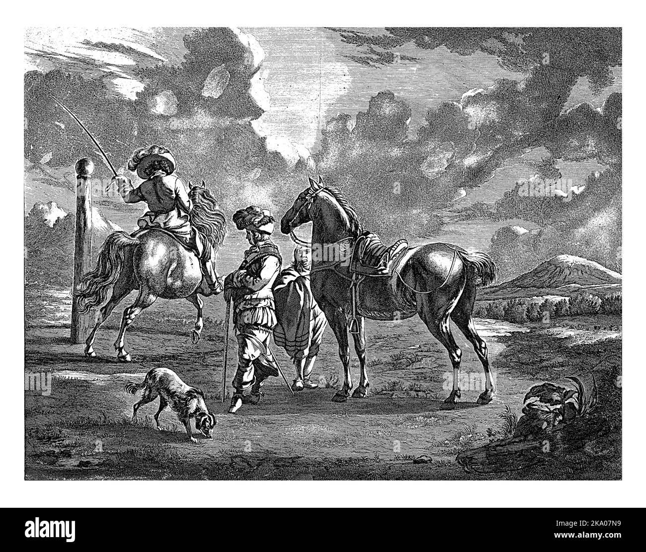 In a landscape, two men stand next to a saddled horse, watching a rider who rides his steed around a pole. Stock Photo