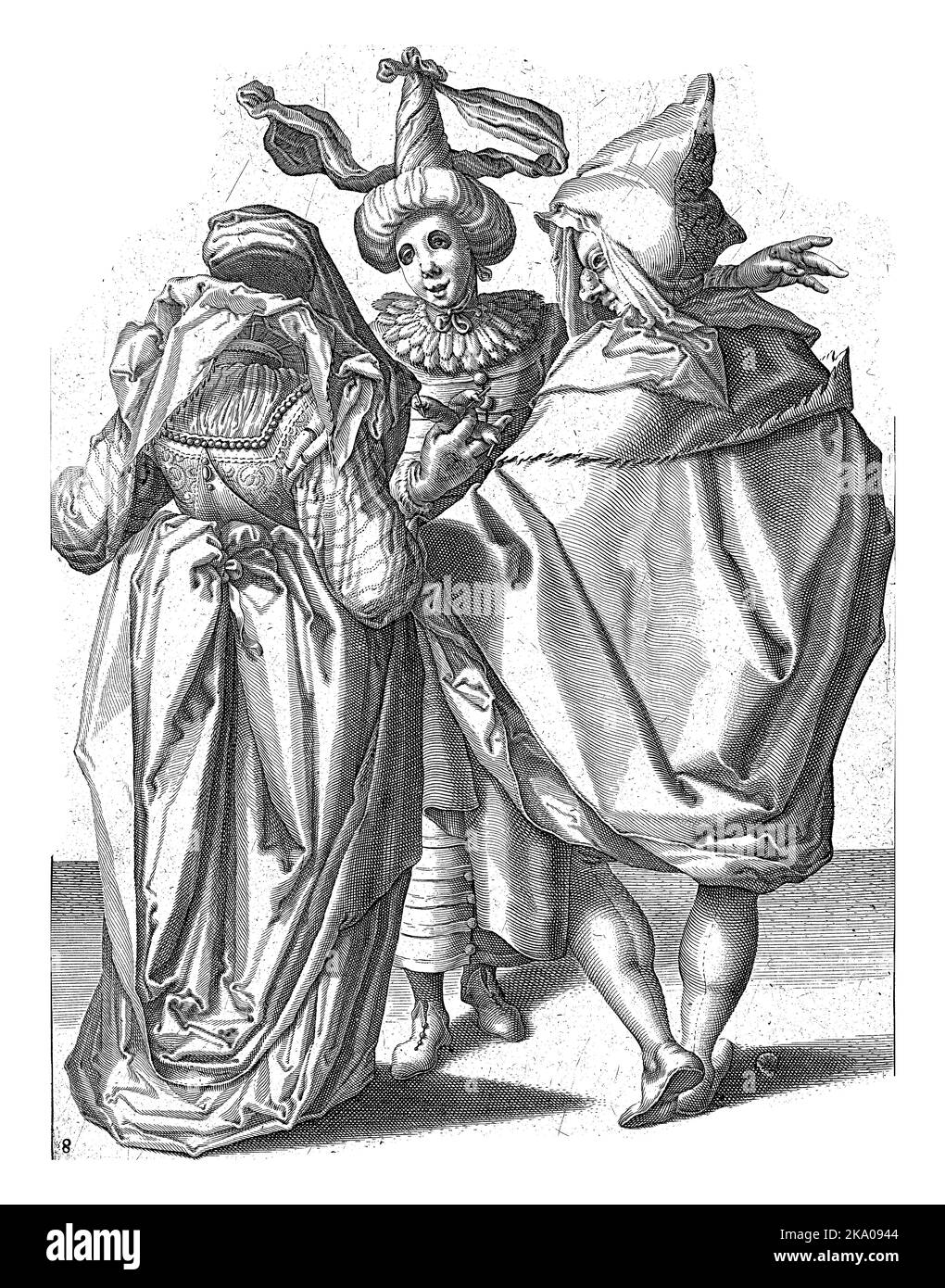 A festively dressed woman and a man in a cape - both seen from the back - stand in front of a masked young man wearing a turban; the latter stretches Stock Photo