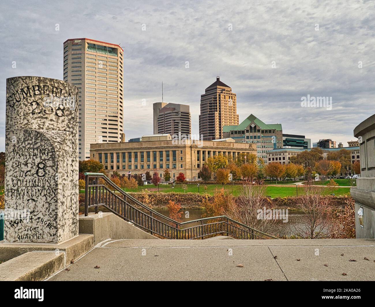 Old National road marker with Columbus Ohio in background Stock Photo