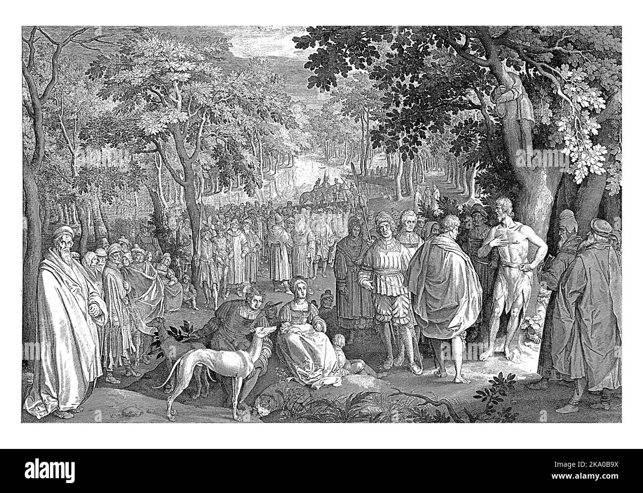A forest landscape. In the foreground right is John the Baptist under a tree. He preaches to a large crowd. Stock Photo